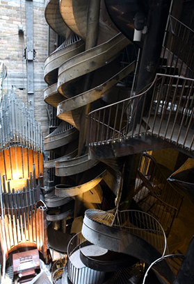a filler image of twisting steel stairs ascending 3 flights